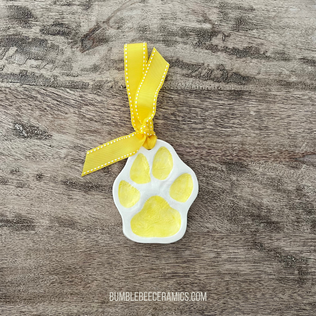 ceramic paw print ornament, amy wright of bumblebee ceramics