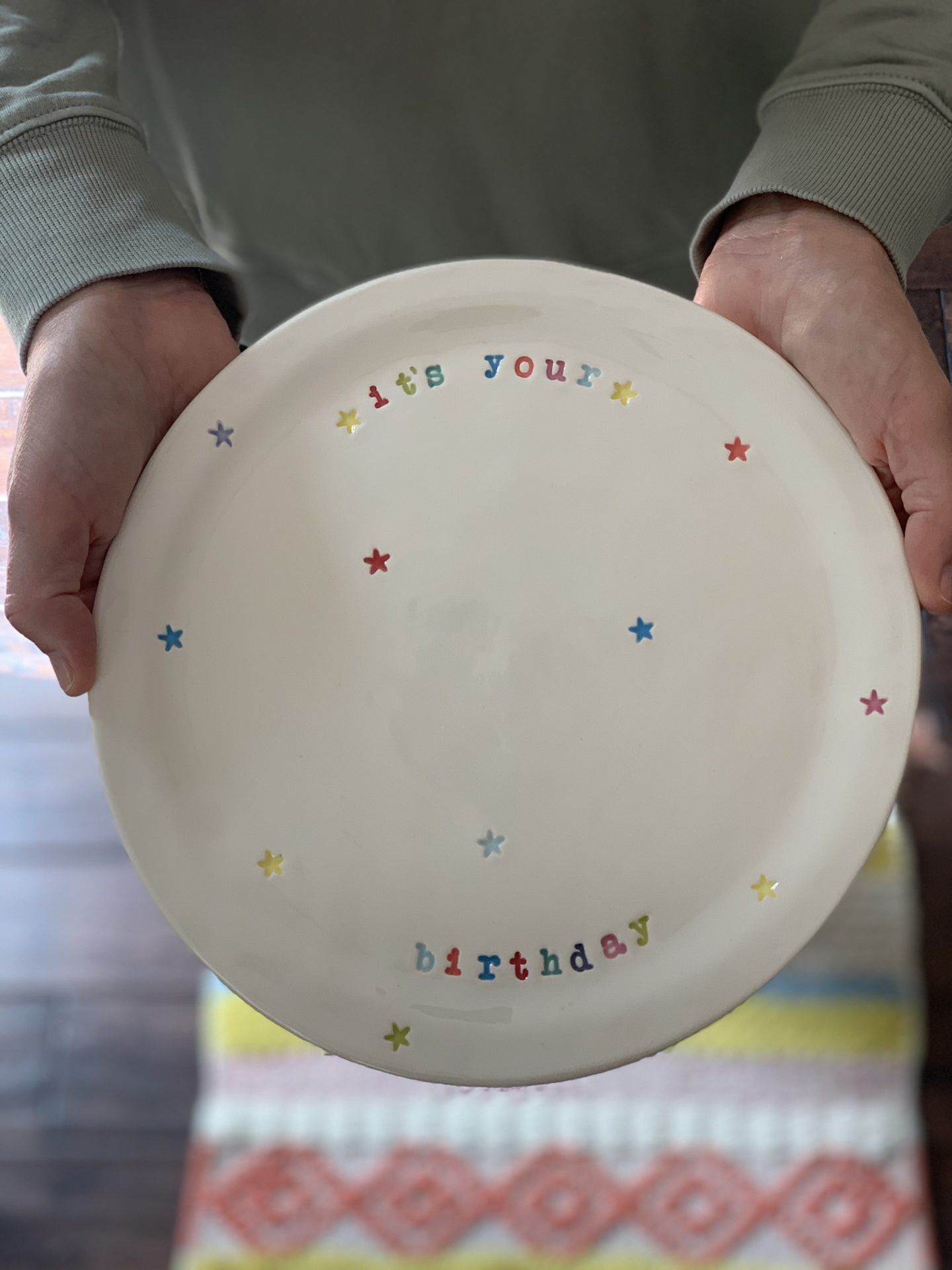 Hands holding a plate