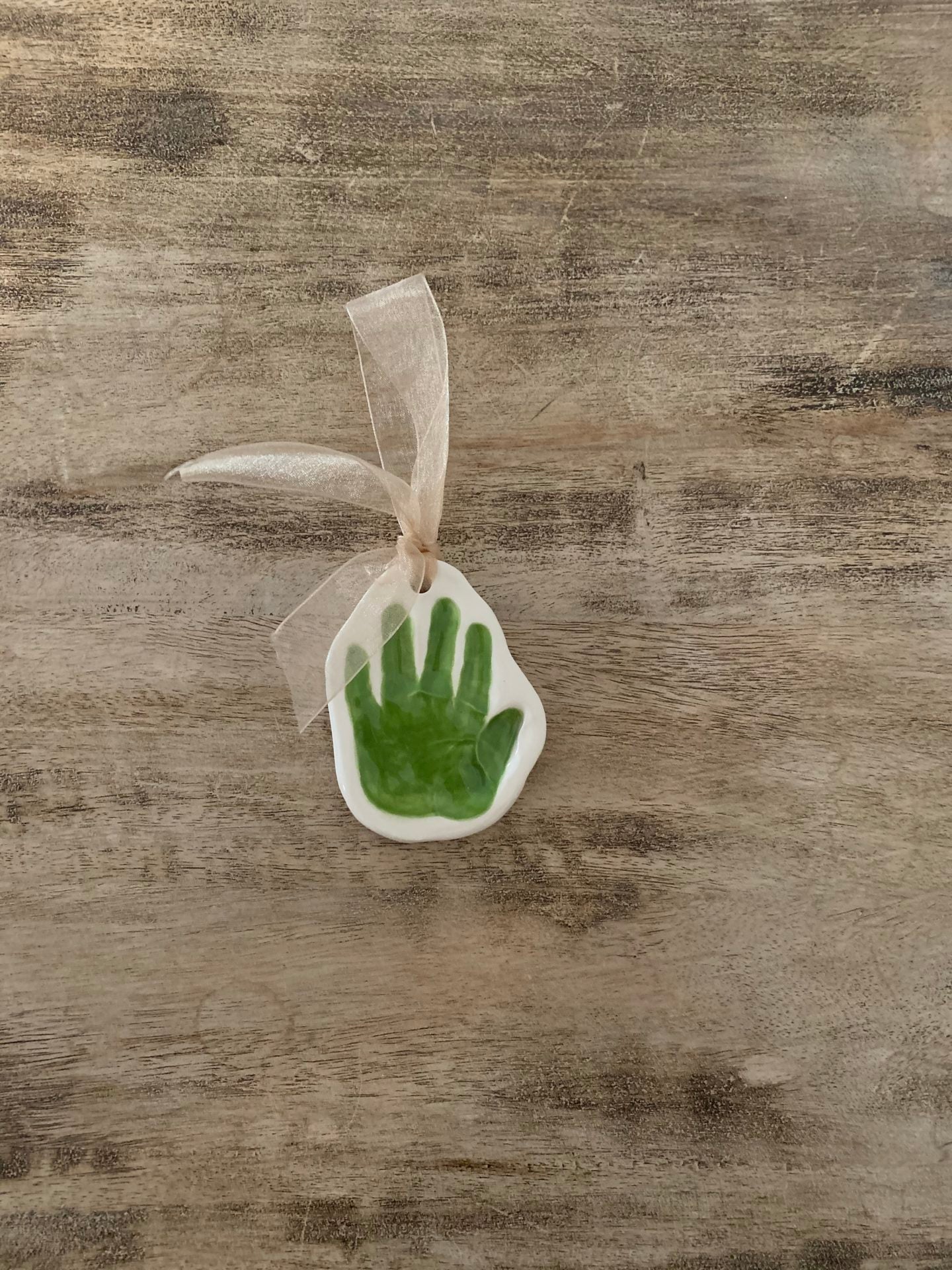 single handprint ornament green