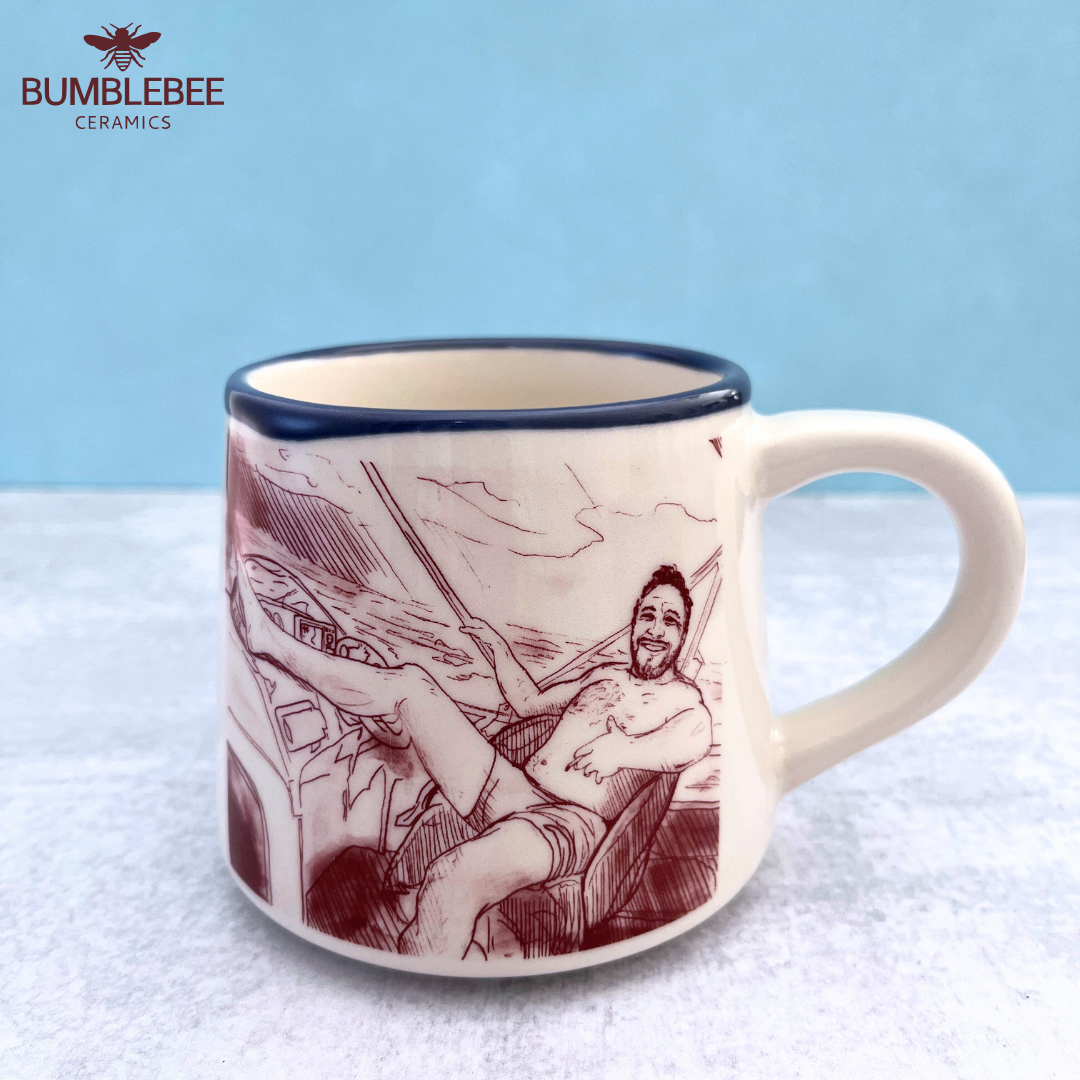 Mug with a printed design of a person in a hammock on a textured surface with a blue background.